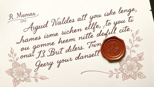 A beautifully crafted handwritten letter with elegant calligraphy, sealed with a wax stamp, and adorned with floral motifs, conveying a sense of nostalgia and personal touch.