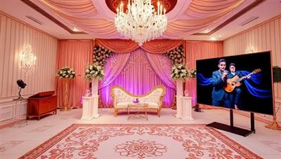 An elegant virtual event setup with a beautifully decorated virtual space for a microcelebration, featuring personalized themes, virtual guest interactions, and a live entertainment segment, creating a memorable and immersive event experience through MicroFest Planner.