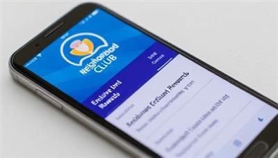 An image of a smartphone displaying the Neighborhood Rewards Club app with a variety of exclusive discounts and rewards from local businesses.