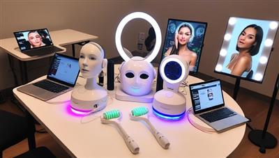 A workshop setup with a variety of beauty tech devices such as facial rollers, LED masks, and smart mirrors displayed on a table, surrounded by laptops and tablets showing beauty apps and tutorials, illustrating a blend of beauty and technology.