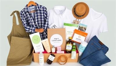 An eco-friendly fashion subscription box displayed with a variety of stylish and sustainable clothing items, accessories, and beauty products, arranged in an aesthetically pleasing layout, highlighting the eco-chic and curated nature of the subscription service.