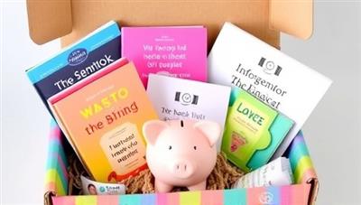 A colorful subscription box filled with financial books, budgeting tools, inspirational quotes, and a mini piggy bank, symbolizing financial empowerment and growth.