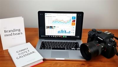 An image of a virtual meeting setup with a laptop showing social media analytics, branding mood boards, and content calendars, surrounded by inspirational quotes, branding books, and a professional camera, symbolizing the creative and strategic aspects of personal branding consultancy.