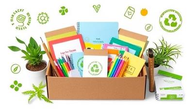 An assortment of colorful and sustainable school supplies arranged in a visually appealing box, surrounded by greenery and eco-friendly symbols, highlighting the eco-conscious and educational aspects of the subscription service.
