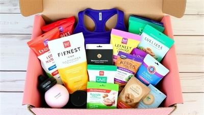 An assortment of fitness and wellness products neatly arranged in a subscription box, featuring workout gear, healthy snacks, self-care items, and motivational resources, creating a vibrant and energizing wellness experience for subscribers.