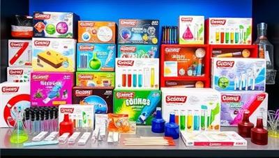 An array of colorful science experiment kits displayed in a vibrant and organized setting, with test tubes, beakers, and various scientific tools, evoking curiosity and excitement for hands-on learning experiences at home.
