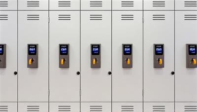 A row of secure, sleek lockers with digital access panels, showcasing the modern and convenient storage options offered by Lock&Load's personalized locker rental service, ideal for urban dwellers and travelers seeking secure storage solutions.