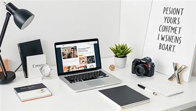 A modern home office setup with a sleek laptop displaying branding materials, surrounded by stylish stationery, a camera for video content creation, and a vision board with inspirational quotes, symbolizing personal branding creativity and professionalism.