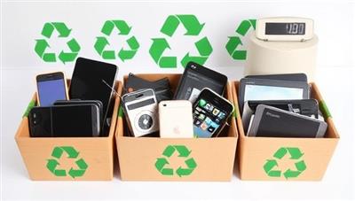 An array of old electronic devices like smartphones, laptops, and tablets being collected in eco-friendly containers, with green recycling symbols and a digital scale in the background, emphasizing the eco-friendly and tech-savvy approach of the business.