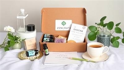 A serene and tranquil scene showcasing the contents of a ZenCrate subscription box, including essential oils, herbal teas, relaxation tools, and a gratitude journal, creating a peaceful and rejuvenating self-care experience.