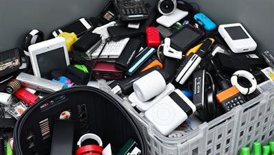 An image of a collection point with various electronic devices and gadgets being sorted for recycling and repurposing, showcasing the eco-friendly and sustainable practices of EcoTech Renew in reducing electronic waste and promoting environmental conservation through tech recycling initiatives.