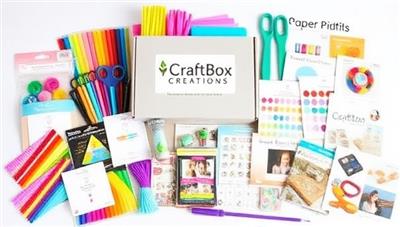 An assortment of colorful craft materials, tools, and finished DIY projects neatly arranged in a CraftBox Creations kit, showcasing the variety and creativity of craft projects available through the DIY Craft Kit Subscriptions service.