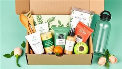 An eye-catching image of a beautifully designed eco-friendly subscription box filled with sustainable products like bamboo utensils, organic skincare samples, plant-based snacks, and a reusable water bottle, promoting a green and conscious lifestyle.