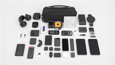 A sleek and modern tech gadget display, showcasing the contents of a Tech Trekker Box with cutting-edge travel accessories, compact smart devices, and digital essentials neatly arranged in a travel-friendly case, embodying innovation and convenience for the modern traveler.