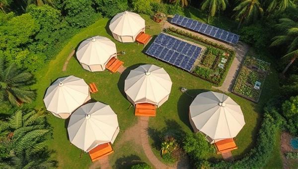 An aerial view of eco-friendly glamping tents nestled among lush greenery, with solar panels, recycling stations, and a communal organic garden in the background, highlighting the sustainable and nature-centric ethos of the retreat.