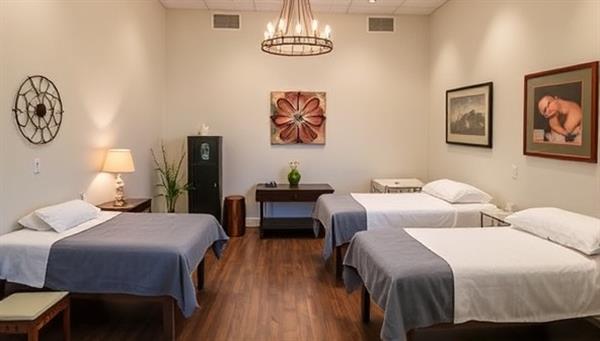An inviting wellness spa environment featuring tranquil treatment rooms, soothing decor, and practitioners offering acupuncture, massage, and energy healing sessions, creating a serene and harmonious space for holistic health and rejuvenation at Harmony Haven Wellness.